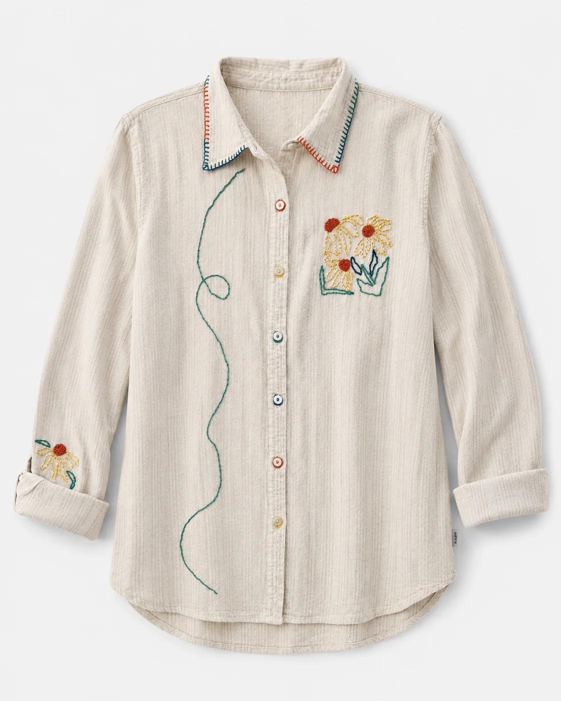 Sunny — natural linen-blend shirt with hand-embroidered wildflowers in mustard, rust and teal and stitched vine detail, flat lay