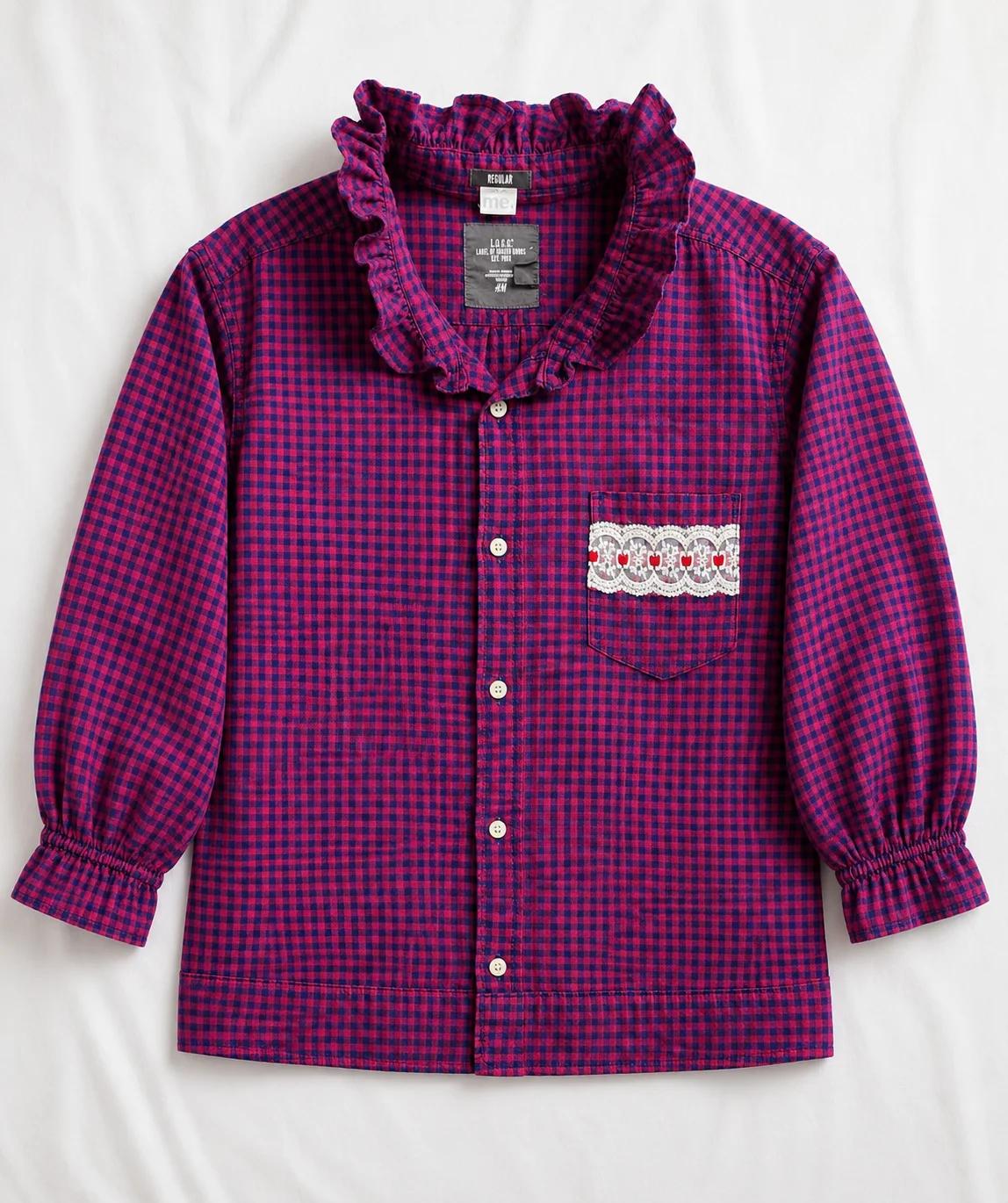 Cameron — raspberry and navy gingham shirt with ruffled collar and neckline, gathered cuffs and lace heart pocket detail, flat lay