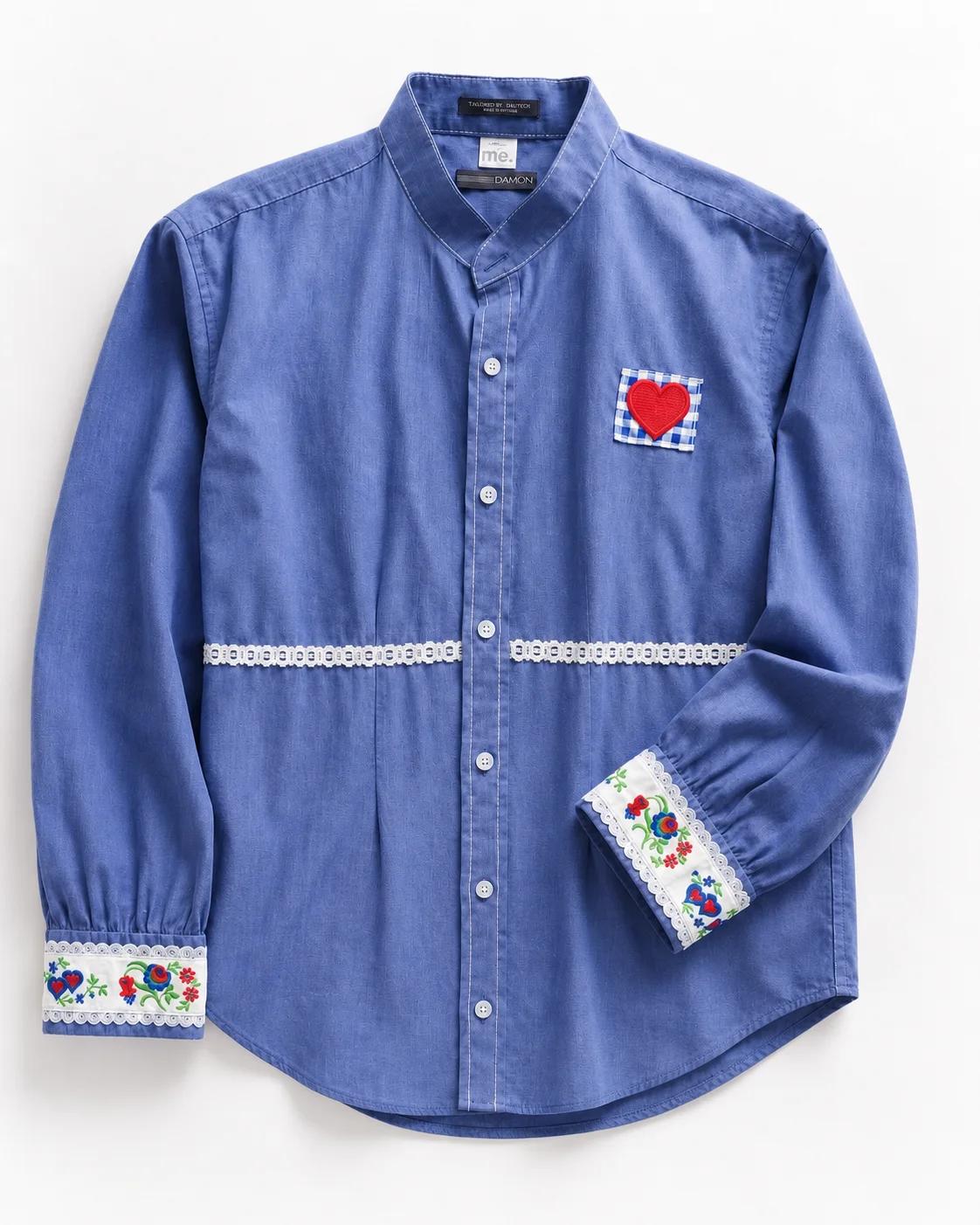 Aggie — soft blue button-front shirt with embroidered floral cuffs, lace waist detail and red gingham heart appliqué, flat lay